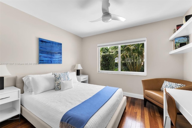 bedroom featuring dark wood-type flooring and ceiling fan