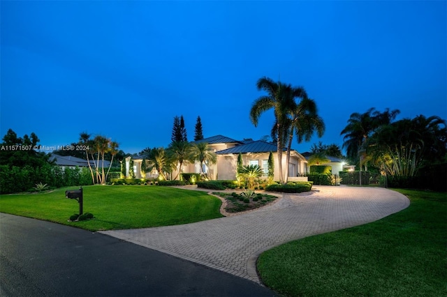 view of front of house with a lawn