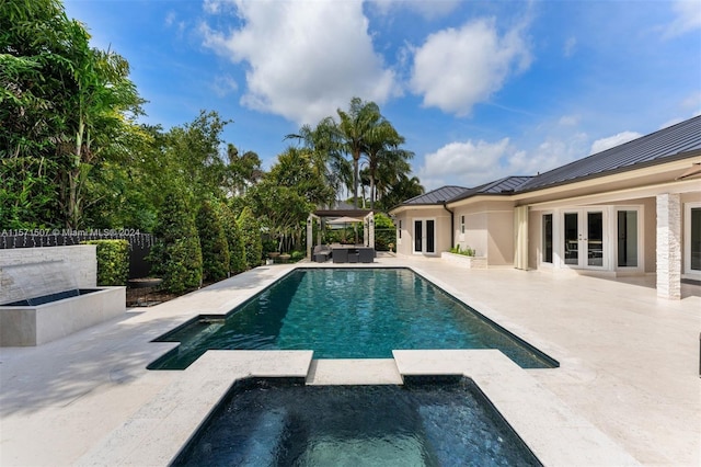 view of swimming pool with a pergola, an in ground hot tub, and a patio area