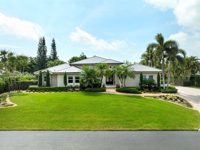 ranch-style house featuring a front lawn