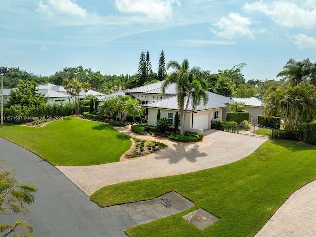 view of front facade featuring a garage and a front lawn