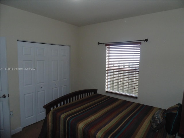 bedroom with a closet and multiple windows