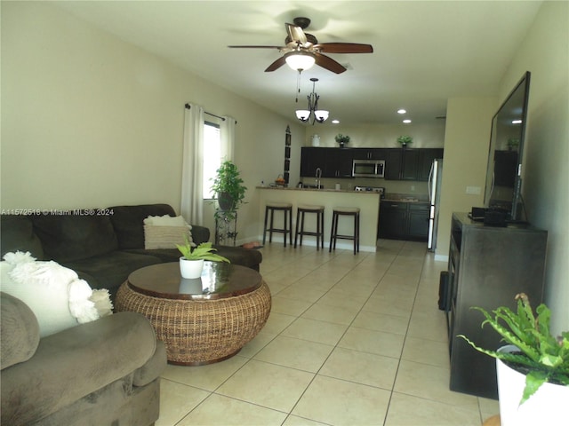 tiled living room with ceiling fan