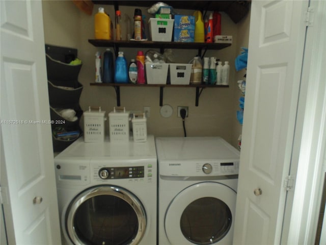 clothes washing area with electric dryer hookup and separate washer and dryer