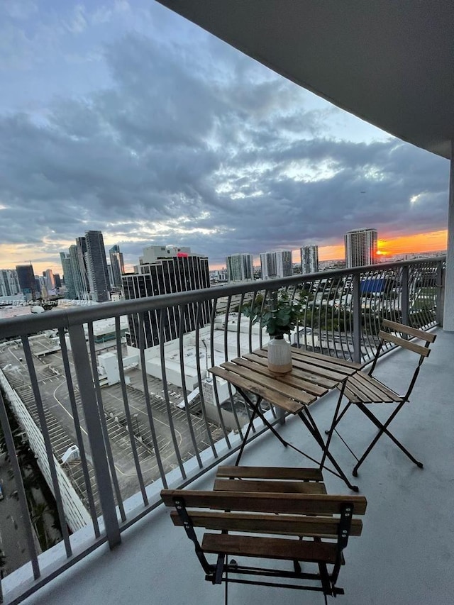 view of balcony at dusk