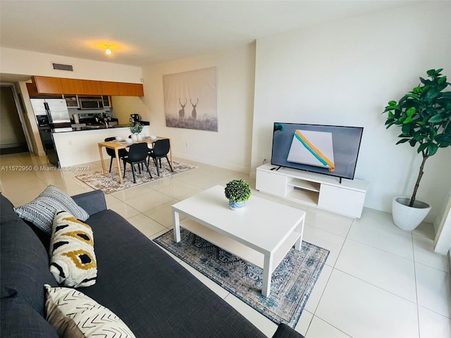 living room featuring light tile floors