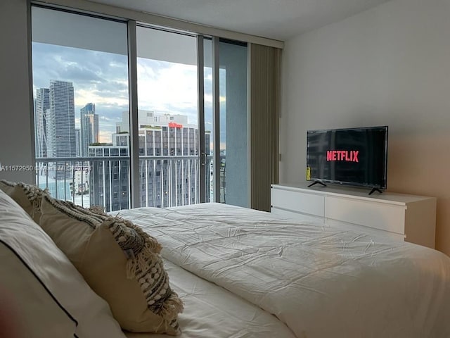 bedroom featuring expansive windows