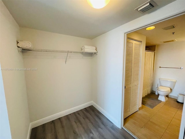 walk in closet featuring wood-type flooring