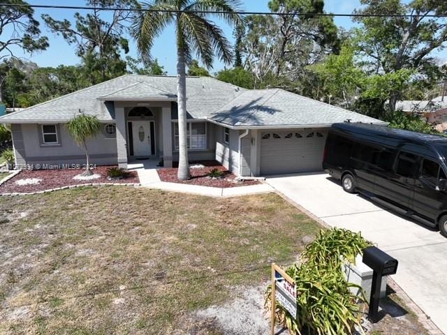 single story home with a garage