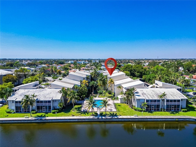 birds eye view of property with a water view