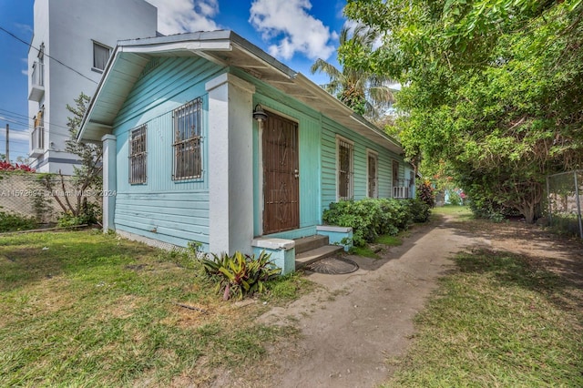 view of home's exterior with a yard