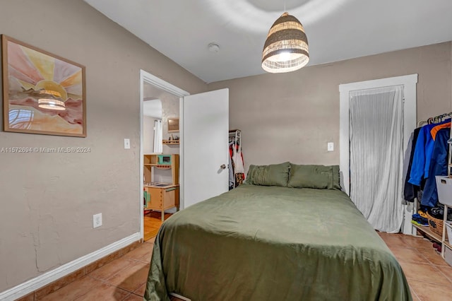 bedroom with light tile floors