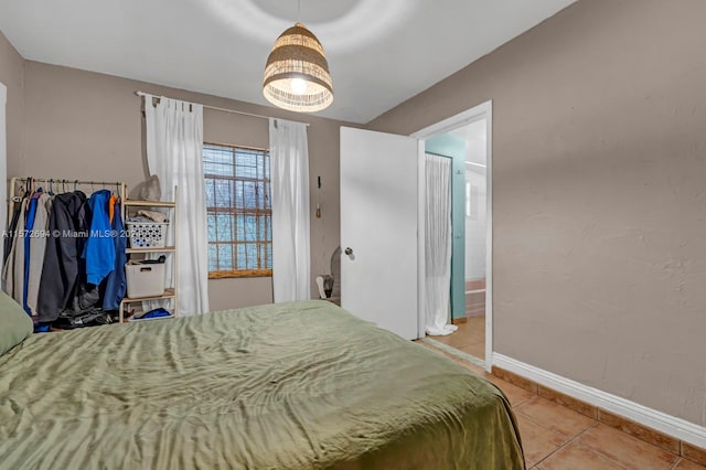 bedroom with light tile floors