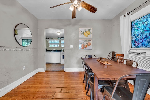 dining area featuring ceiling fan and light hardwood / wood-style floors