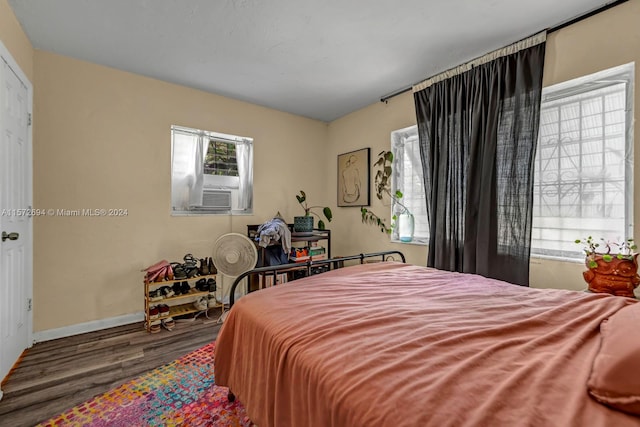 bedroom featuring dark wood-type flooring