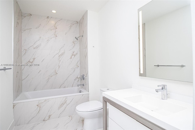 full bathroom featuring tiled shower / bath, toilet, oversized vanity, and tile flooring