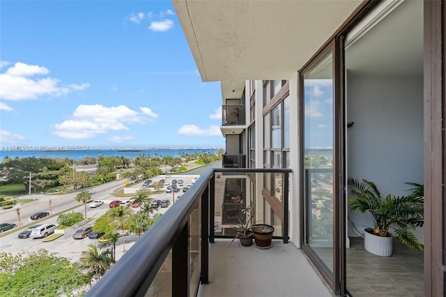 balcony featuring a water view