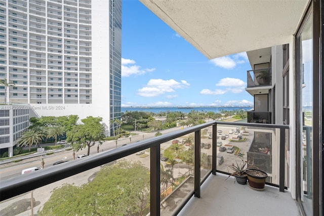 balcony featuring a water view