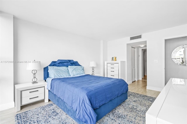 bedroom with light hardwood / wood-style floors