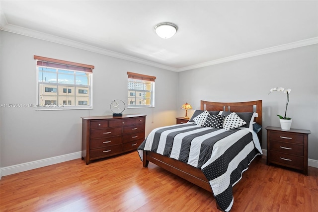 bedroom with light hardwood / wood-style floors and ornamental molding