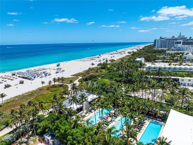 aerial view featuring a water view and a beach view