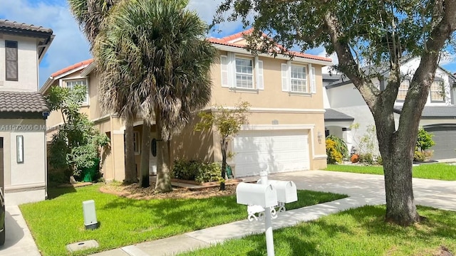 mediterranean / spanish home with a garage and a front yard