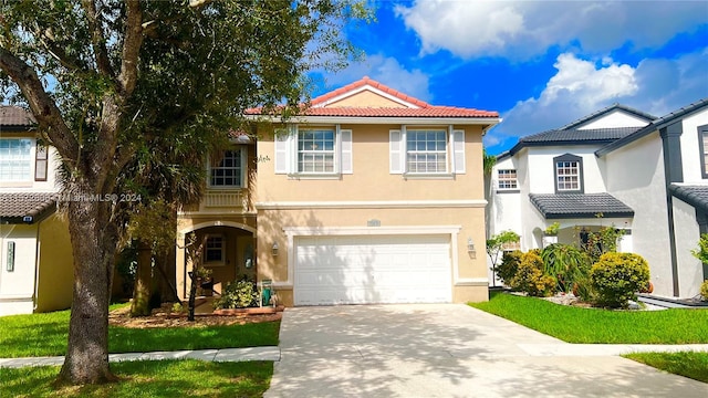 mediterranean / spanish-style house featuring a garage