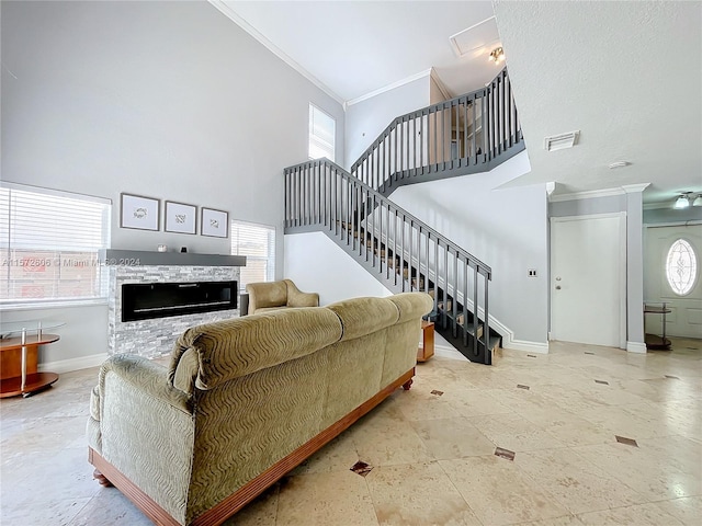 living room with crown molding and a high ceiling