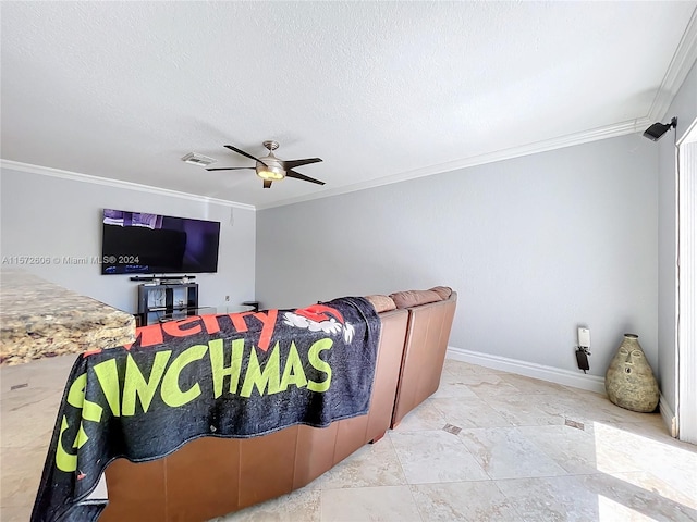 living room featuring a textured ceiling, ceiling fan, and crown molding