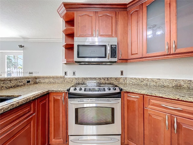 kitchen featuring light stone countertops and stainless steel appliances