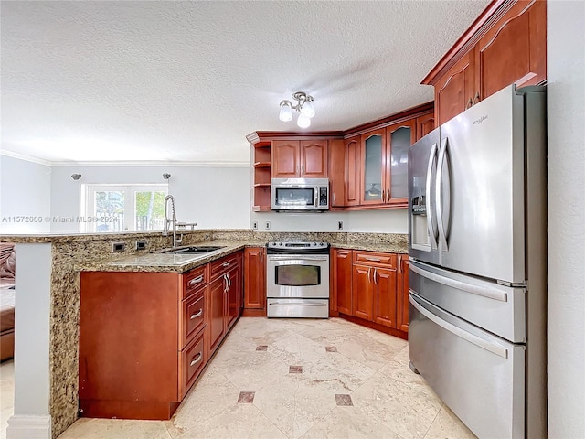 kitchen featuring kitchen peninsula, sink, ornamental molding, and appliances with stainless steel finishes