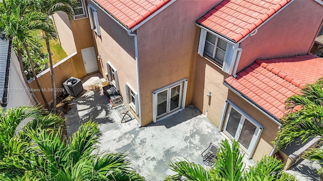 view of property featuring central AC unit