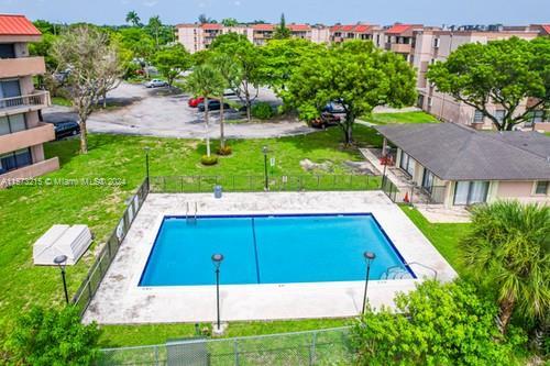 view of pool featuring a yard and a patio area