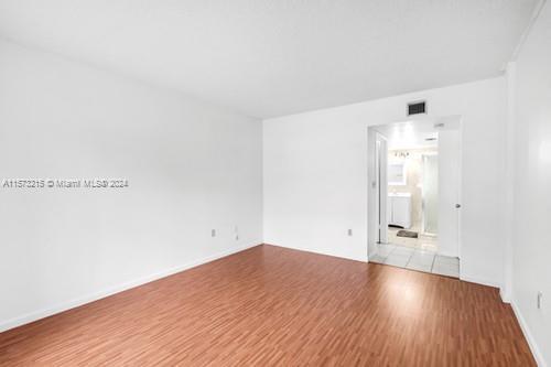 unfurnished room with light hardwood / wood-style floors