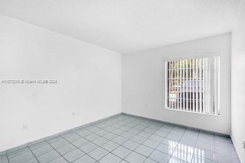 spare room with light tile patterned floors