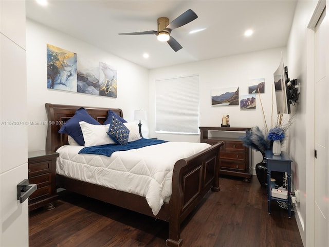 bedroom featuring ceiling fan and dark wood-type flooring