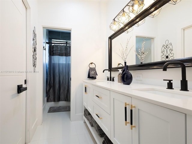 bathroom featuring tile flooring and double sink vanity