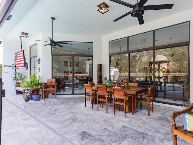 view of patio featuring ceiling fan