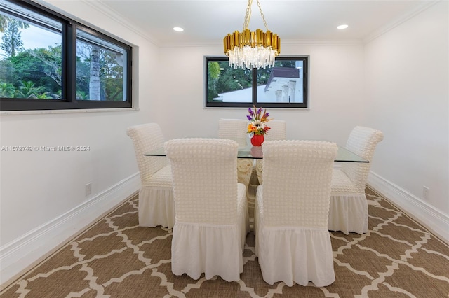 dining room featuring crown molding and a chandelier