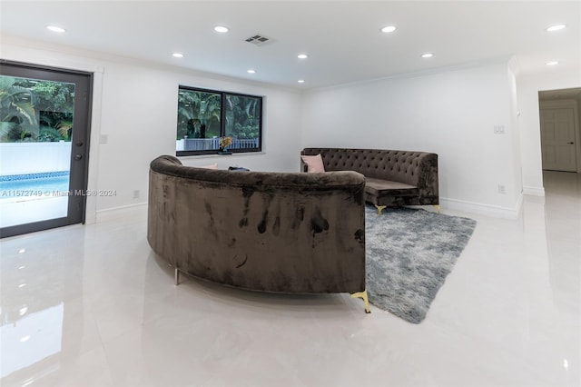 living room featuring ornamental molding and light tile patterned floors