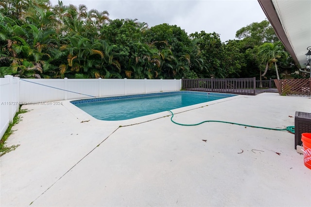 view of swimming pool with a patio