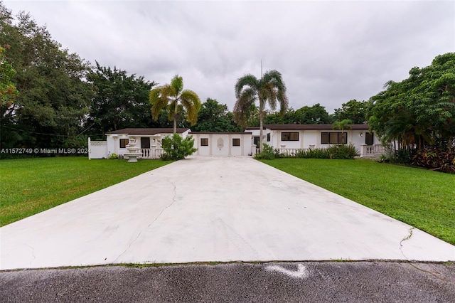 ranch-style home with a front lawn