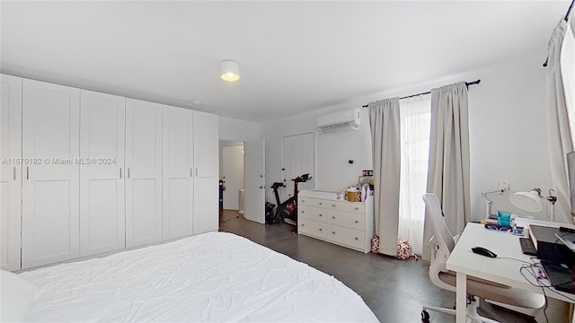 bedroom with a closet and a wall mounted AC