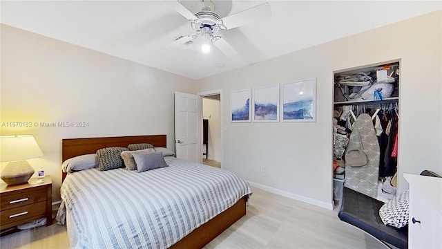 bedroom featuring a closet, ceiling fan, and light hardwood / wood-style flooring