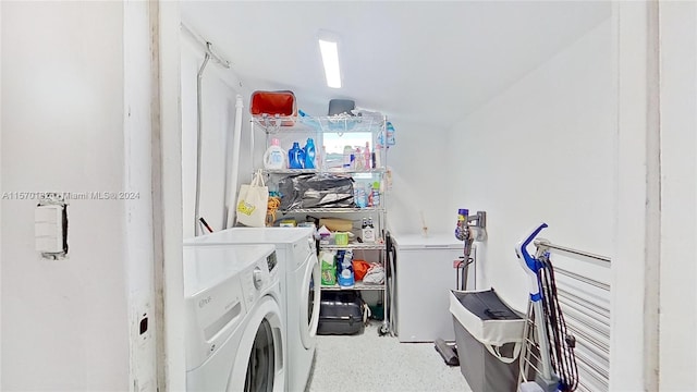 laundry room featuring washing machine and clothes dryer