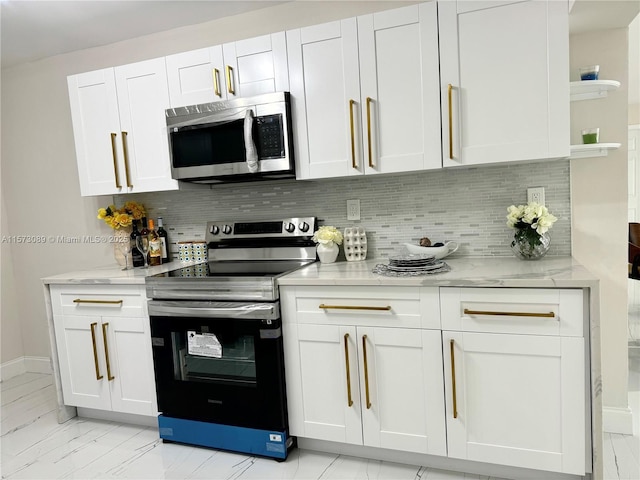 kitchen with decorative backsplash, white cabinetry, and stainless steel appliances