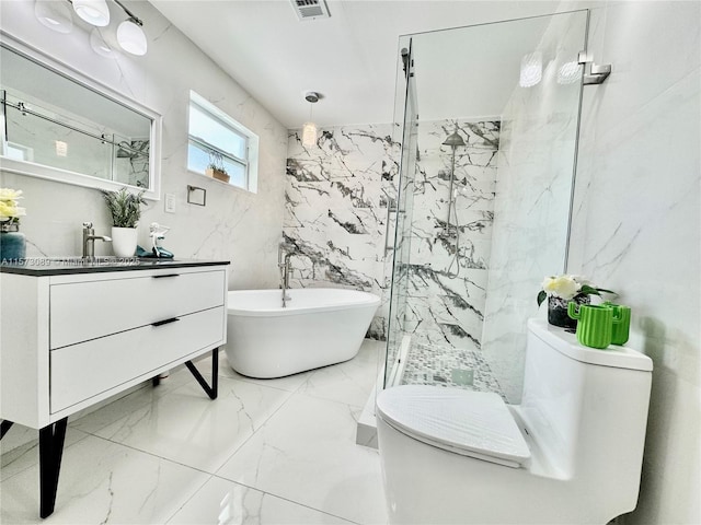 full bathroom featuring vanity, toilet, shower with separate bathtub, and tile walls