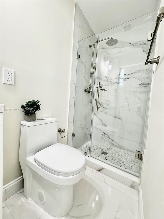 bathroom with toilet and walk in shower