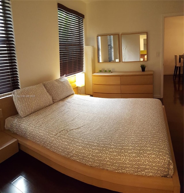 bedroom featuring dark hardwood / wood-style floors