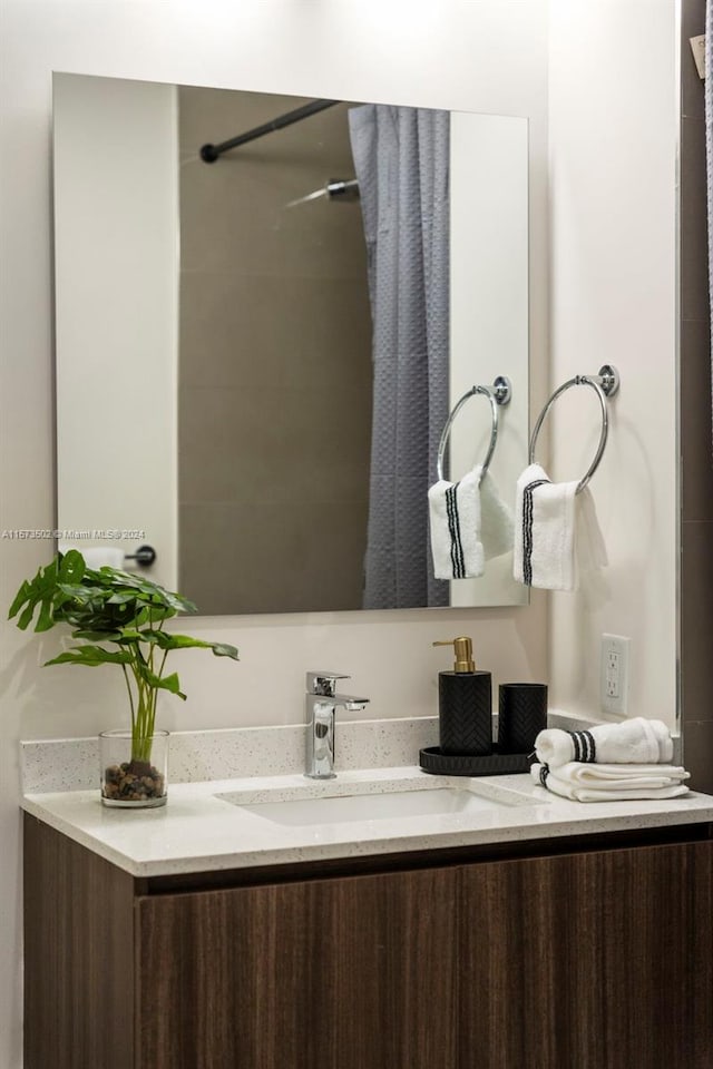 bathroom with vanity with extensive cabinet space